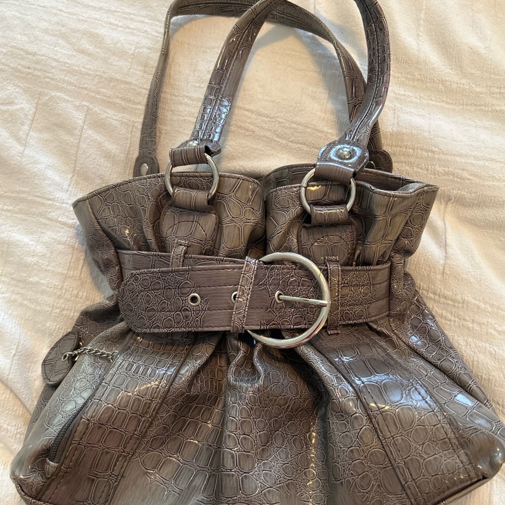 Chic and roomy croc-embossed tote in a glossy taupe finish.